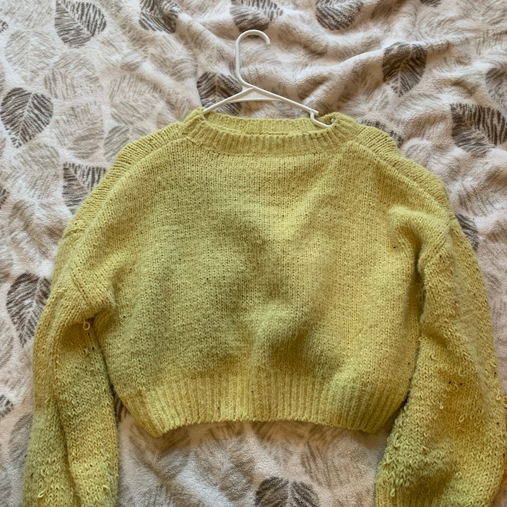 Yellow knitted sweater
